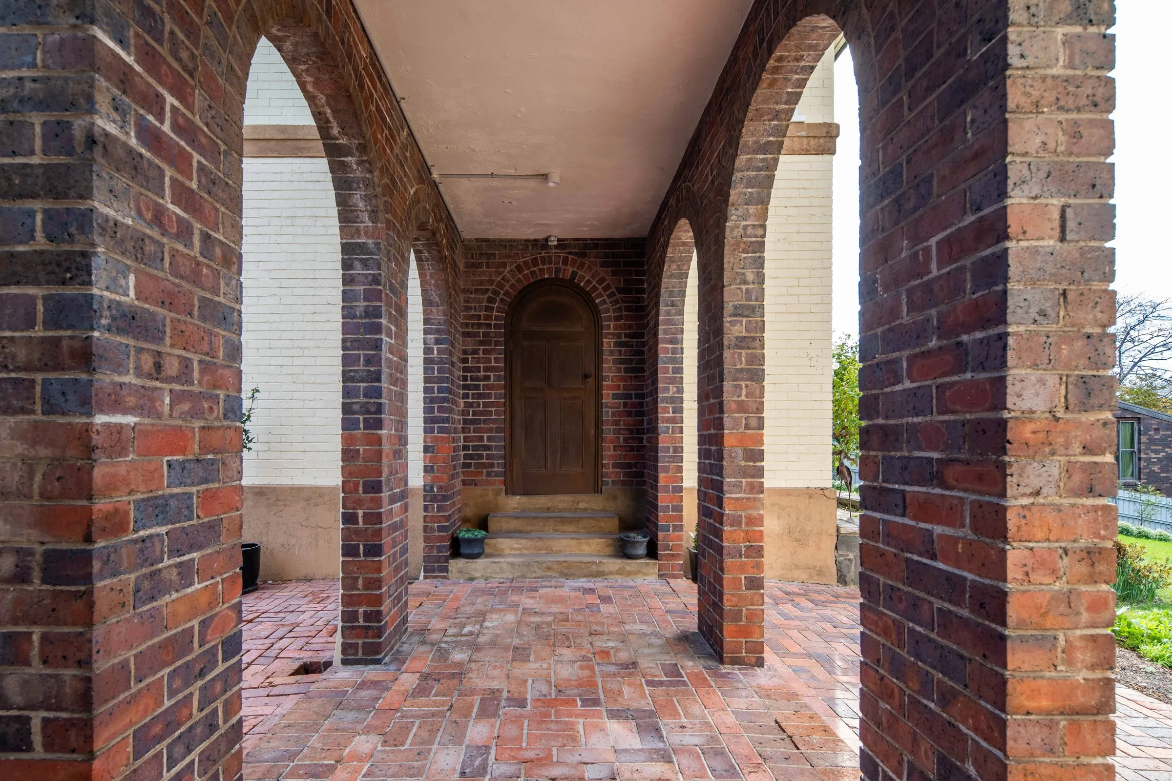 The brick arches of a finished carport, East Launceston