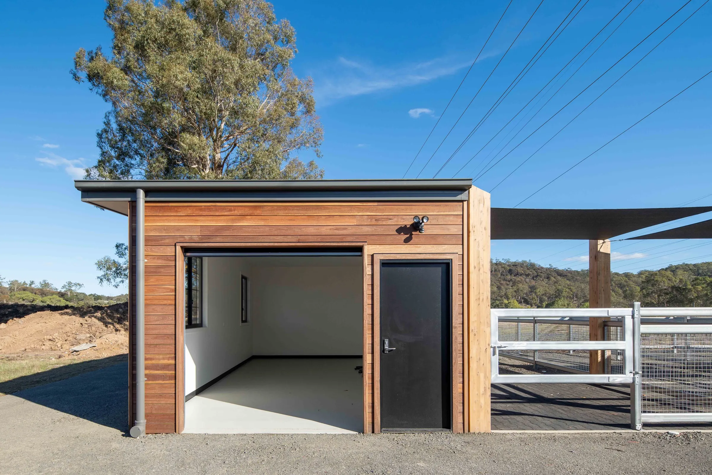 A finished timber-clad stable building with a grey roof, Prospect