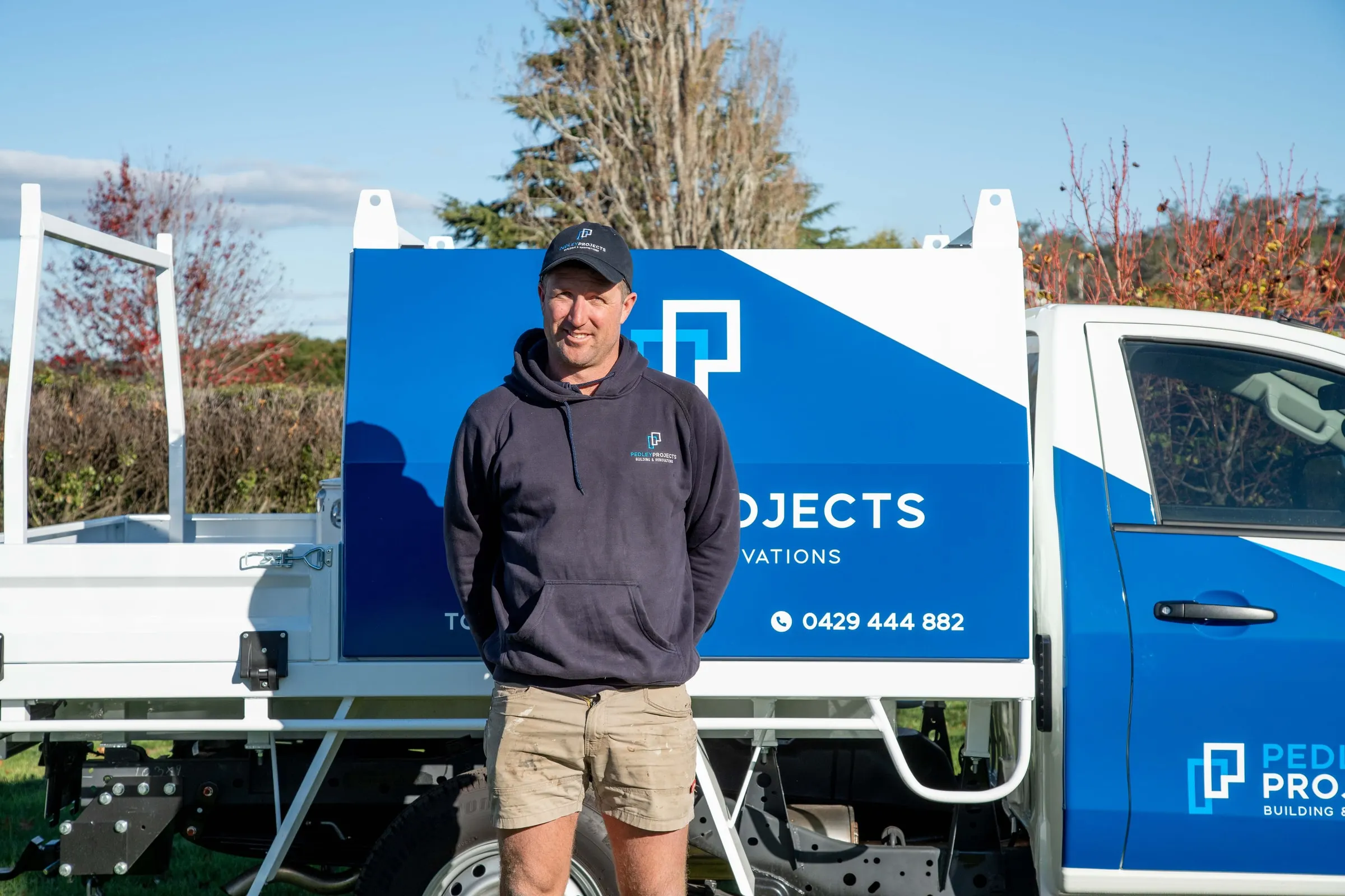 Tom Pedley standing beside a Pedley Projects ute